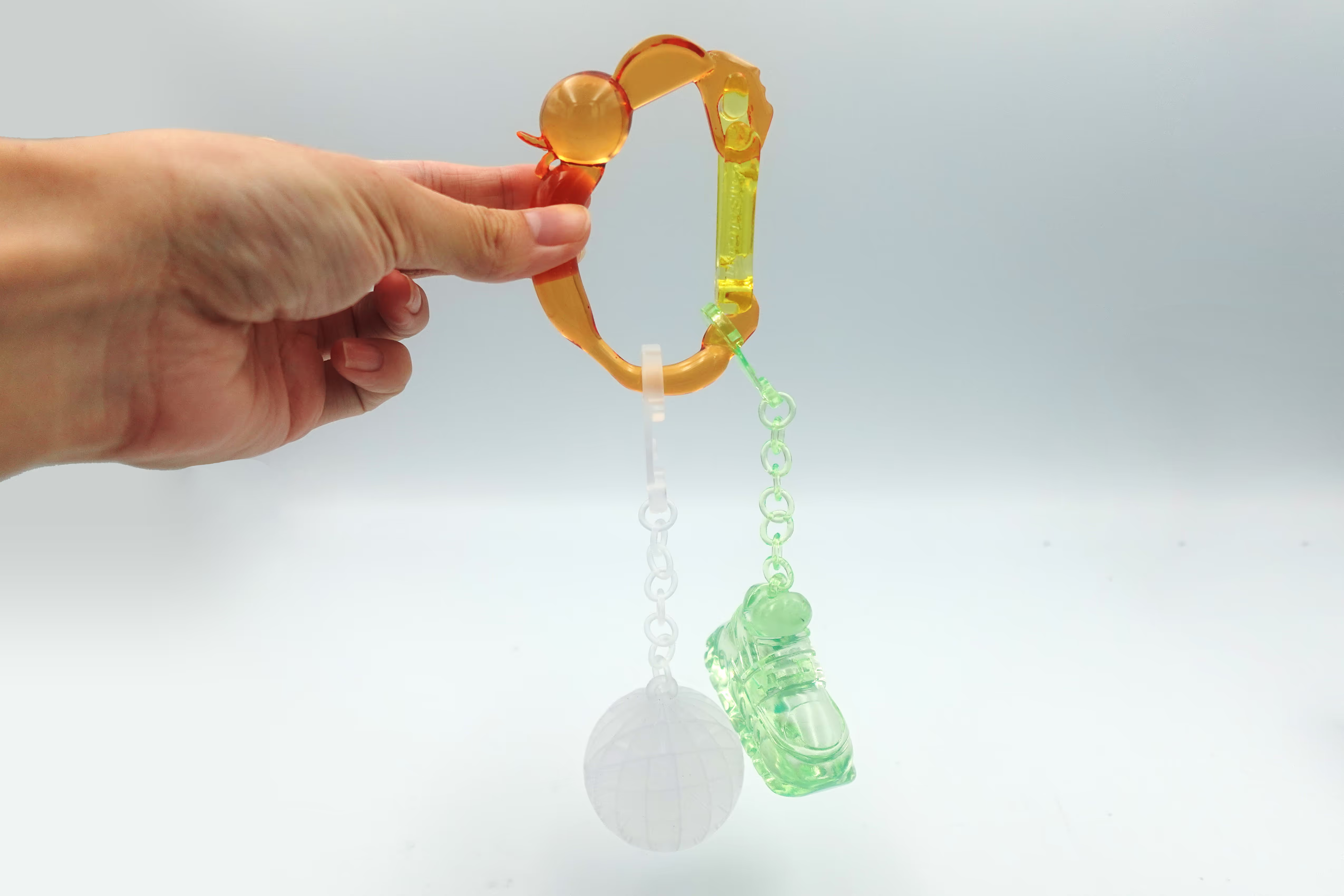 Custom 3D printed ornaments hangign from a 3D printed carabiner